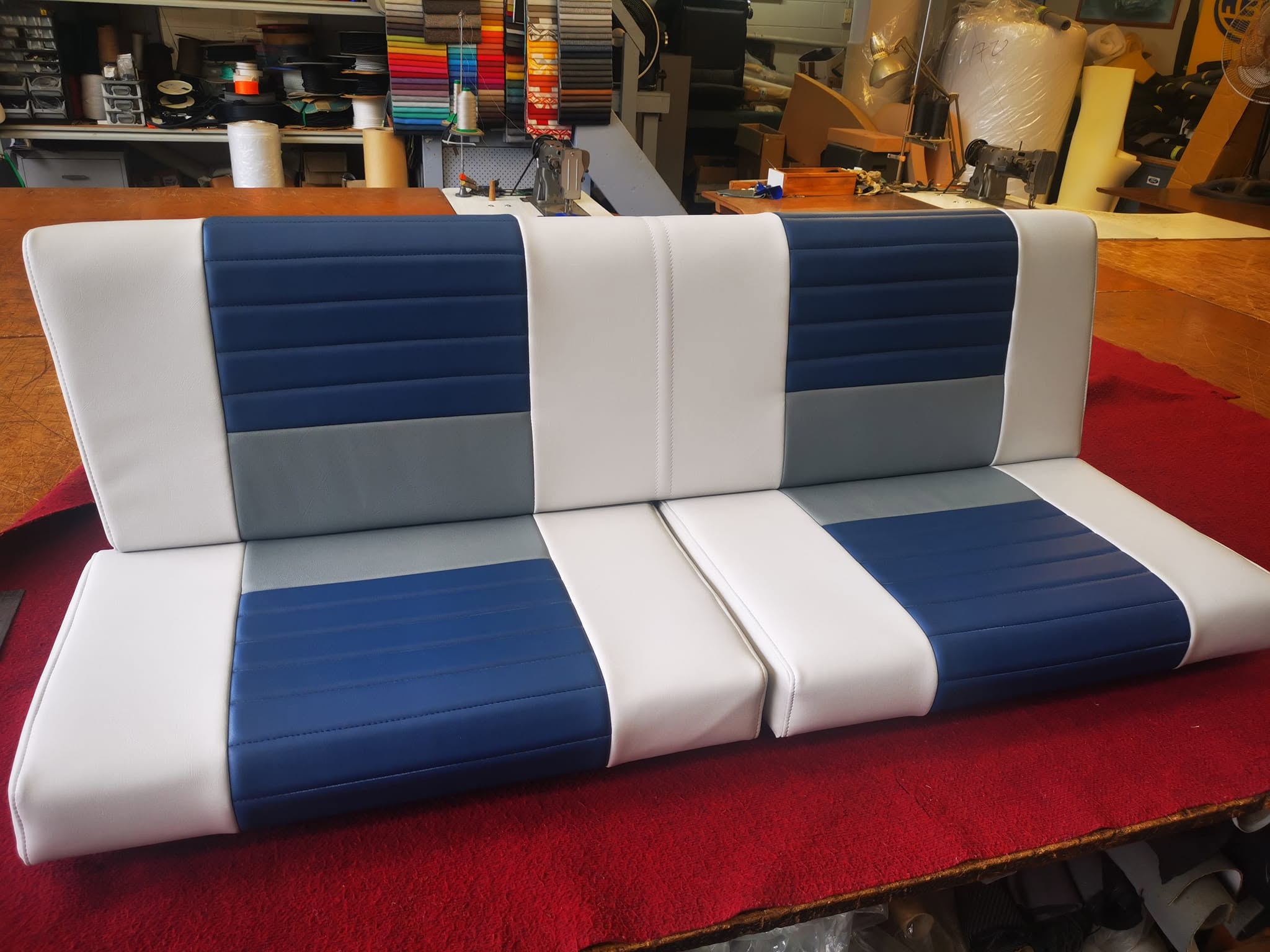 Blue, grey and white squabs finished on the bench