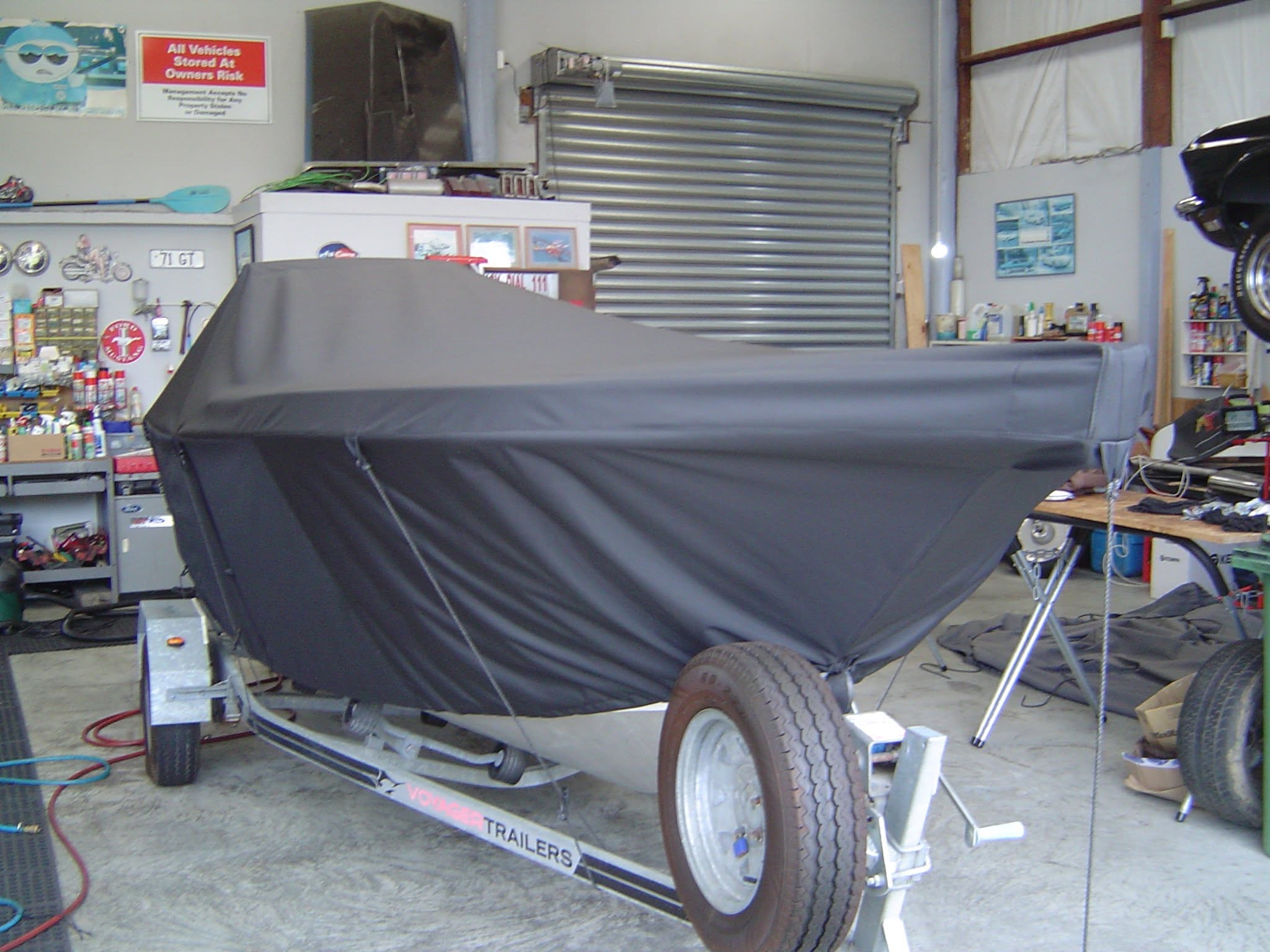 Black storage cover over a boat